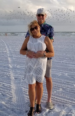 Mike Marinelli embracing wife on beach